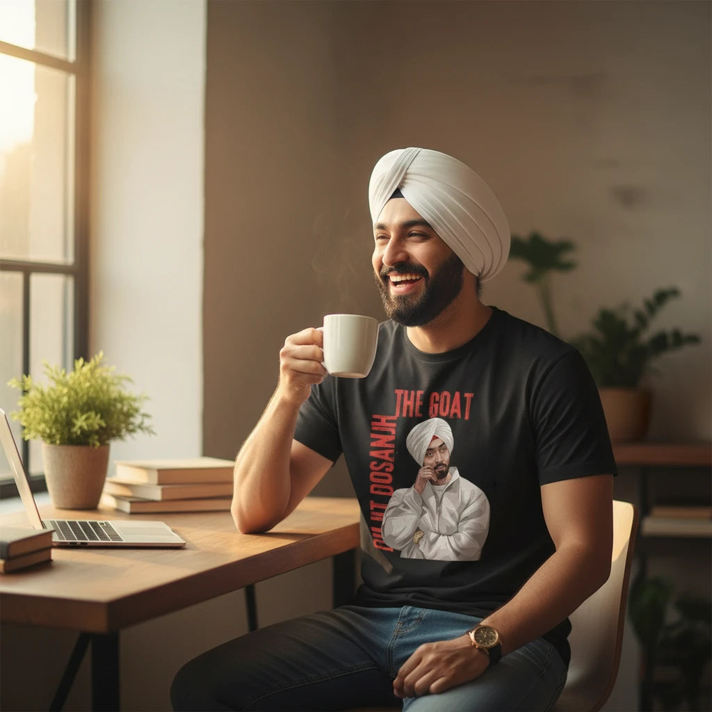 Make It Custom black cotton crewneck t-shirt featuring a Diljit Dosanjh The Goat graphic worn by a smiling man.